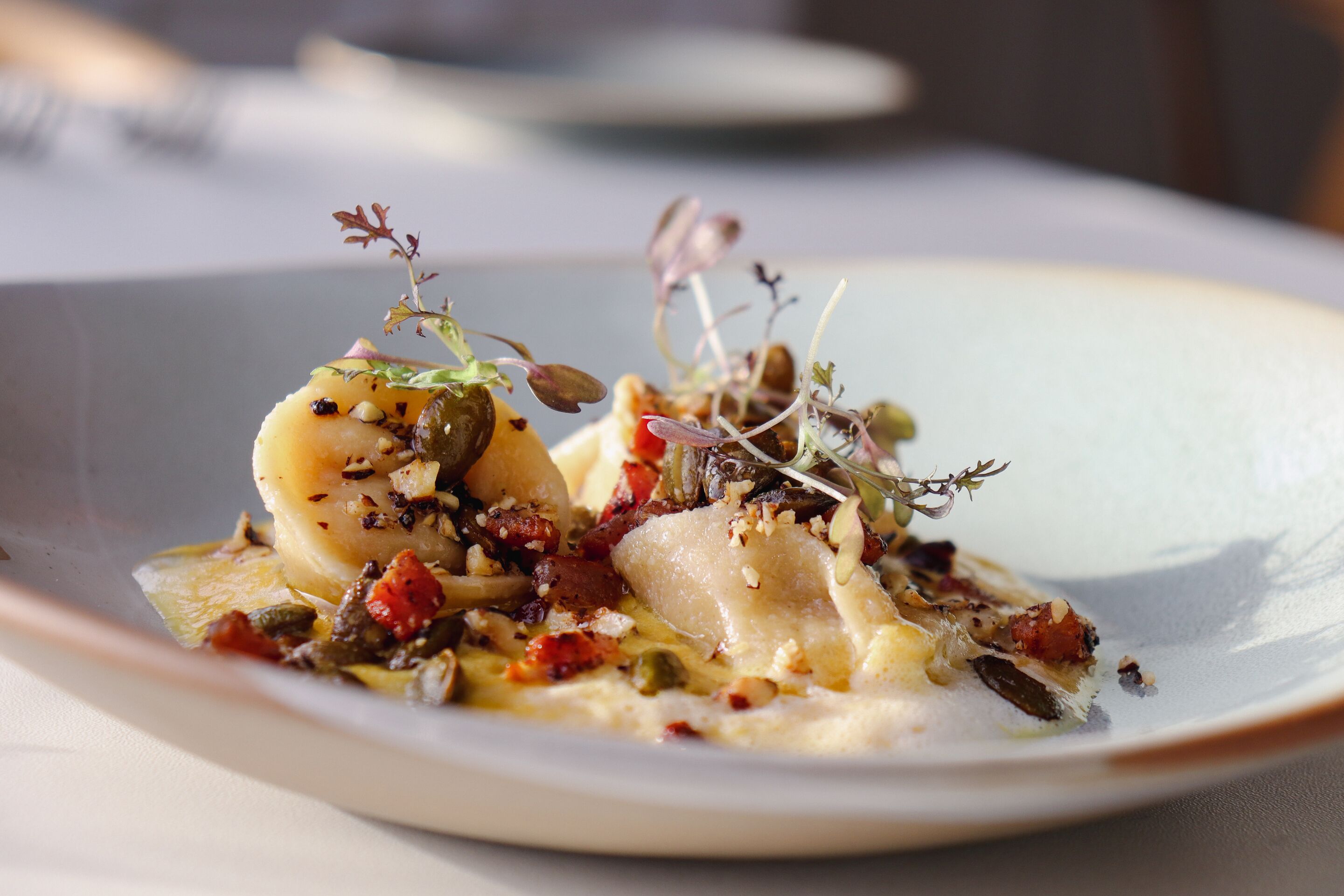 A plate of food with various ingredients and garnishes.