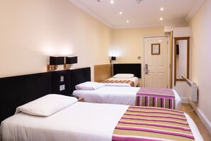 Triple Room | 1 bedroom, in-room safe, desk, blackout drapes