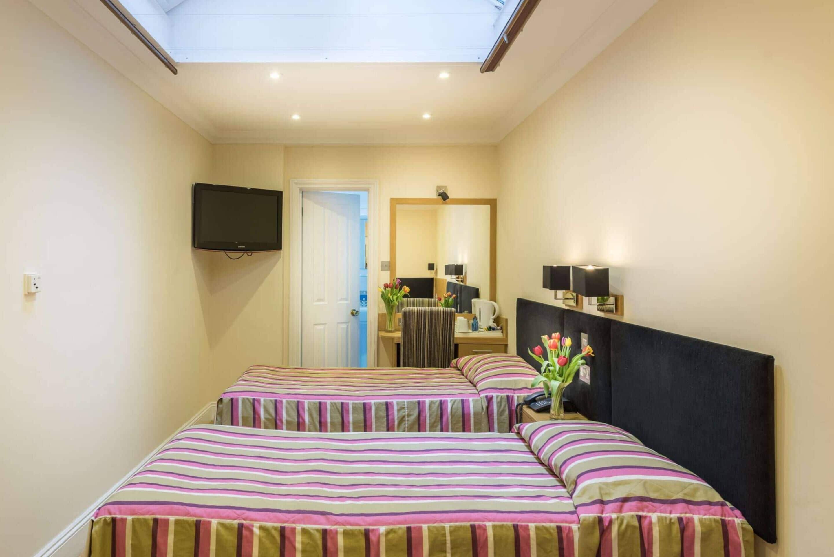 twin room | in-room safe, desk, blackout curtains, iron/ironing board