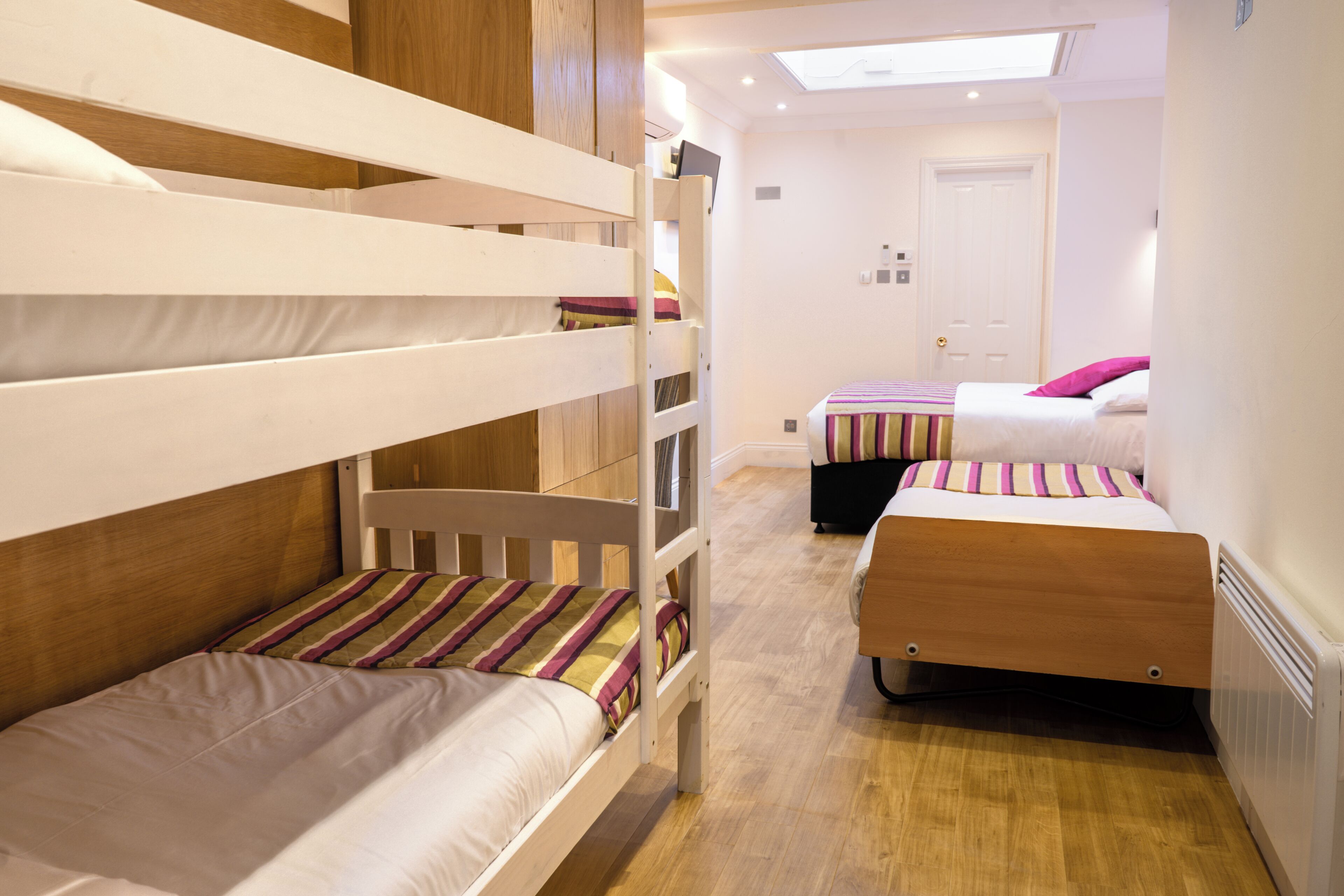 family room | in-room safe, desk, blackout curtains, iron/ironing board