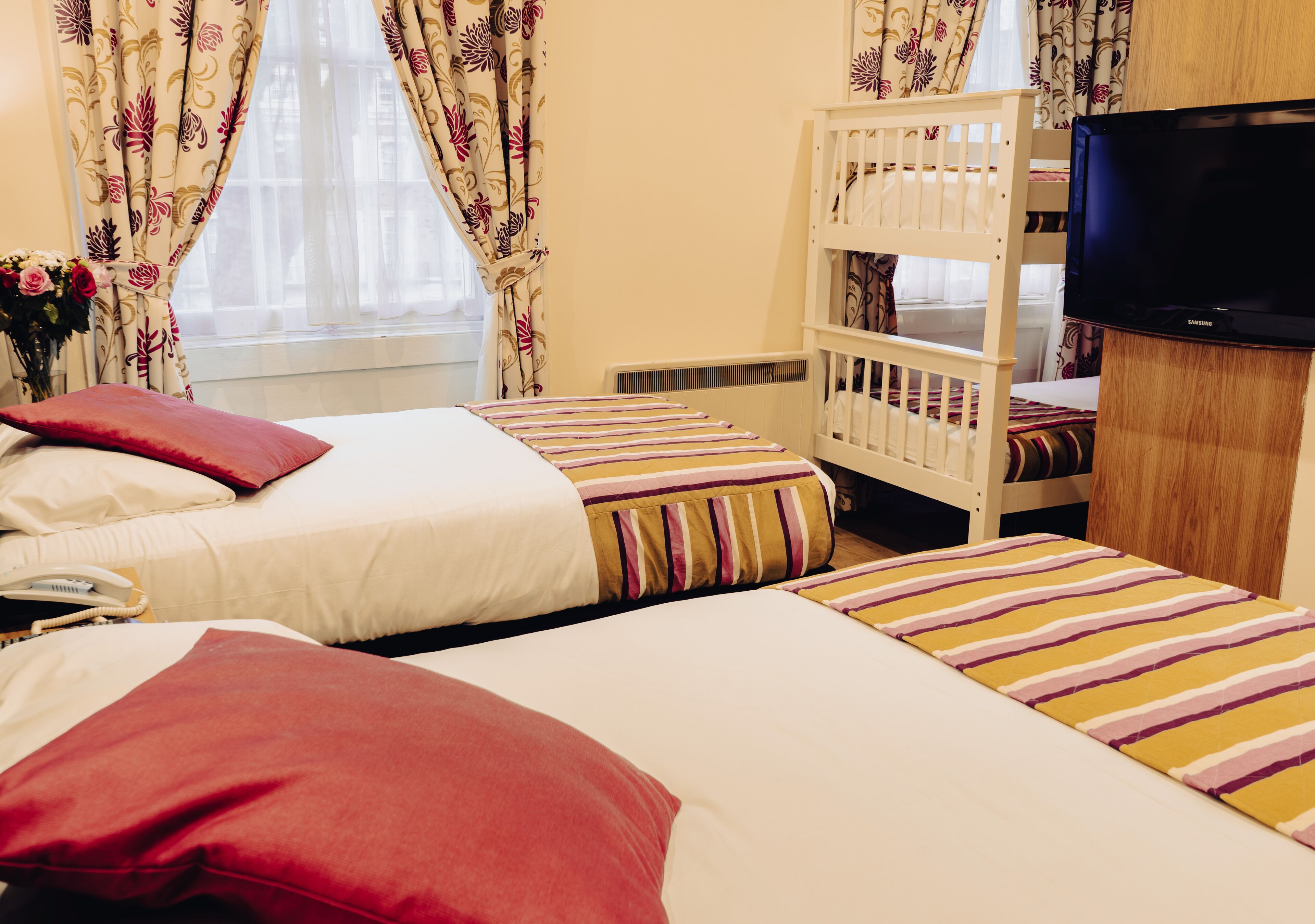 family room | in-room safe, desk, blackout curtains, iron/ironing board