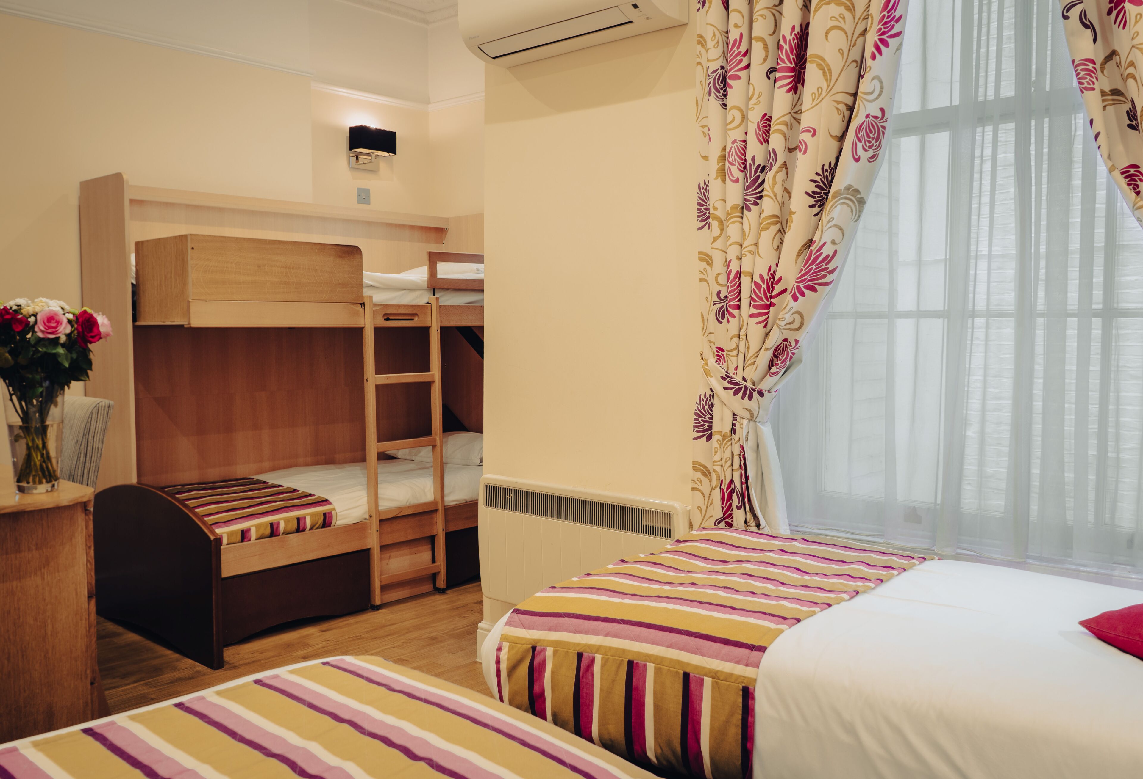 family room | in-room safe, desk, blackout curtains, iron/ironing board