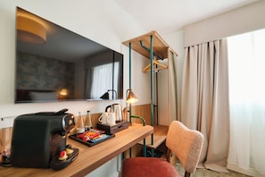 Desk, laptop workspace, blackout drapes, iron/ironing board