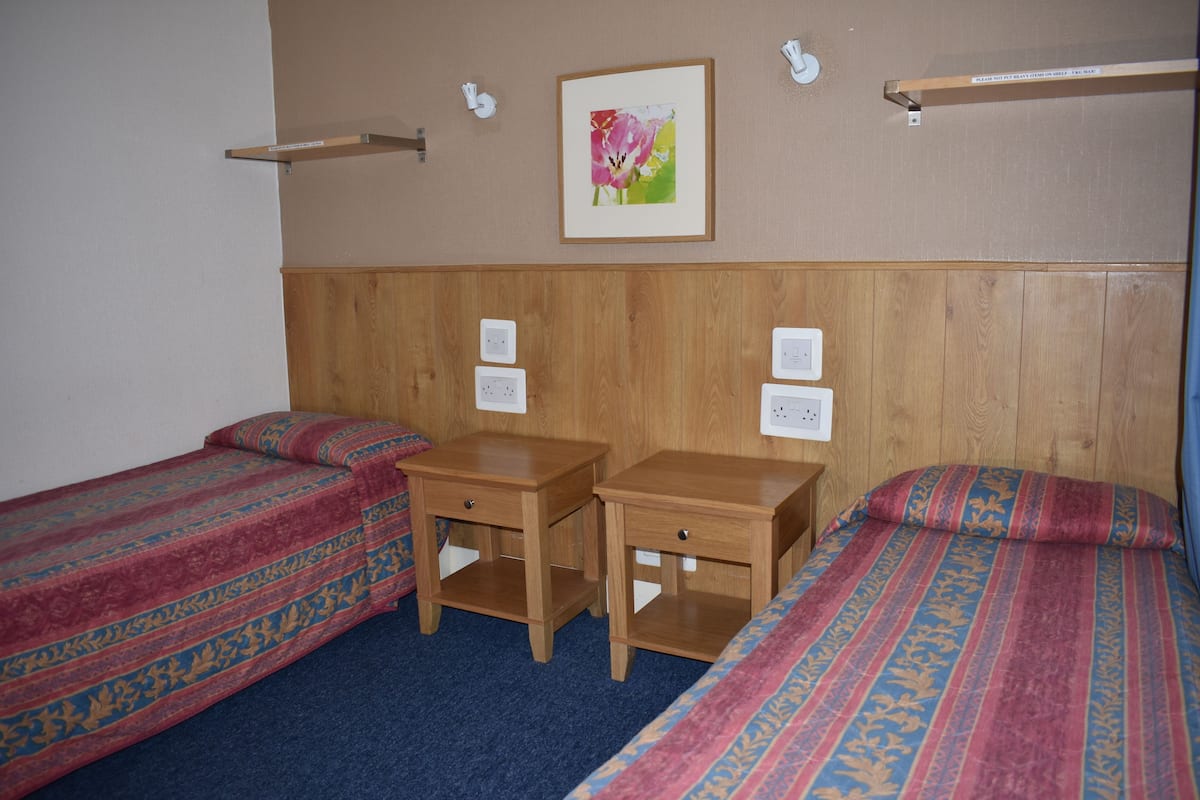 Basic Twin Room, Shared Bathroom | Down comforters, blackout drapes, iron/ironing board (on request)
