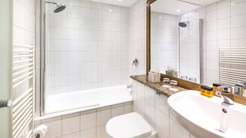 Shower, designer toiletries, hair dryer, towels