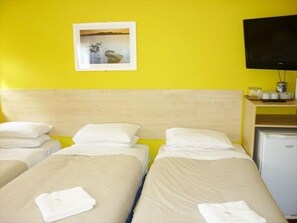 Triple Room, Shared Bathroom | Iron/ironing board, bed sheets