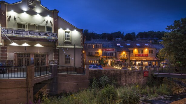 A theater with a balcony, a pub named 'Old Bridge', and a stone bridge over a stream. - The Old Bridge Inn, Holmfirth, West Yorkshire (Holmfirth)