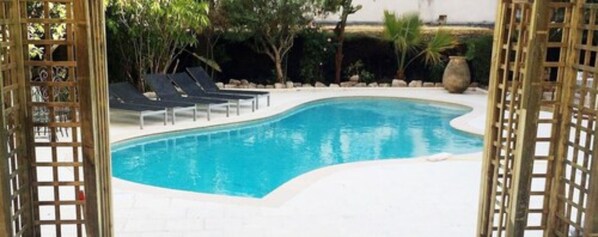 Outdoor pool, pool umbrellas, pool loungers