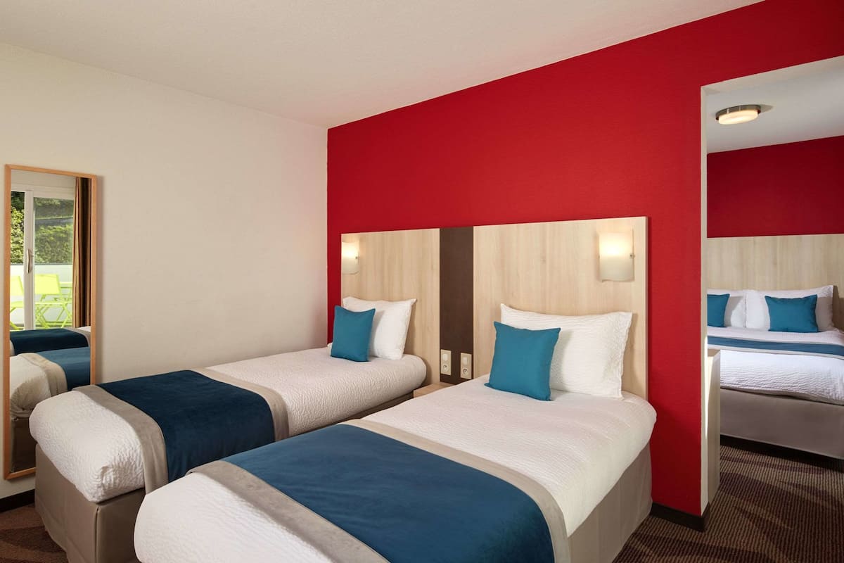 Comfort Quadruple Room | Premium bedding, in-room safe, desk, laptop workspace