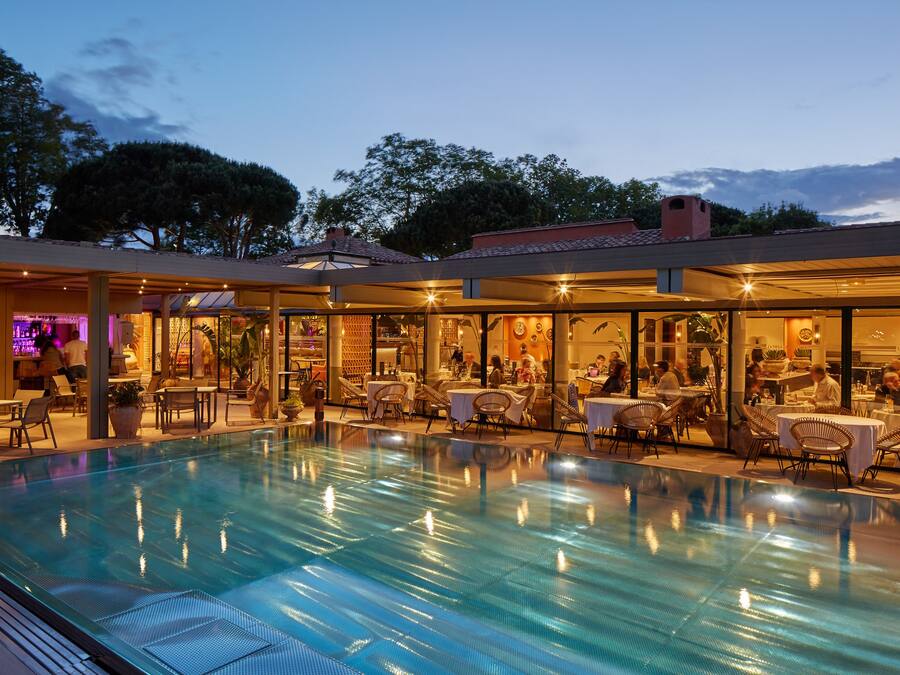 Seasonal outdoor pool, open 8:00 AM to 7:30 PM, pool umbrellas