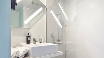 Shower, rainfall showerhead, hair dryer, towels