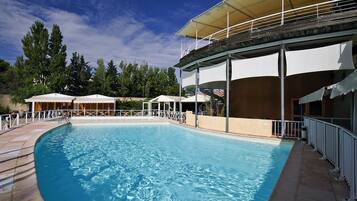 Seasonal outdoor pool, open 10:00 AM to 8:00 PM, pool loungers