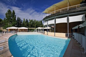 Seasonal outdoor pool, open 10:00 AM to 8:00 PM, pool loungers