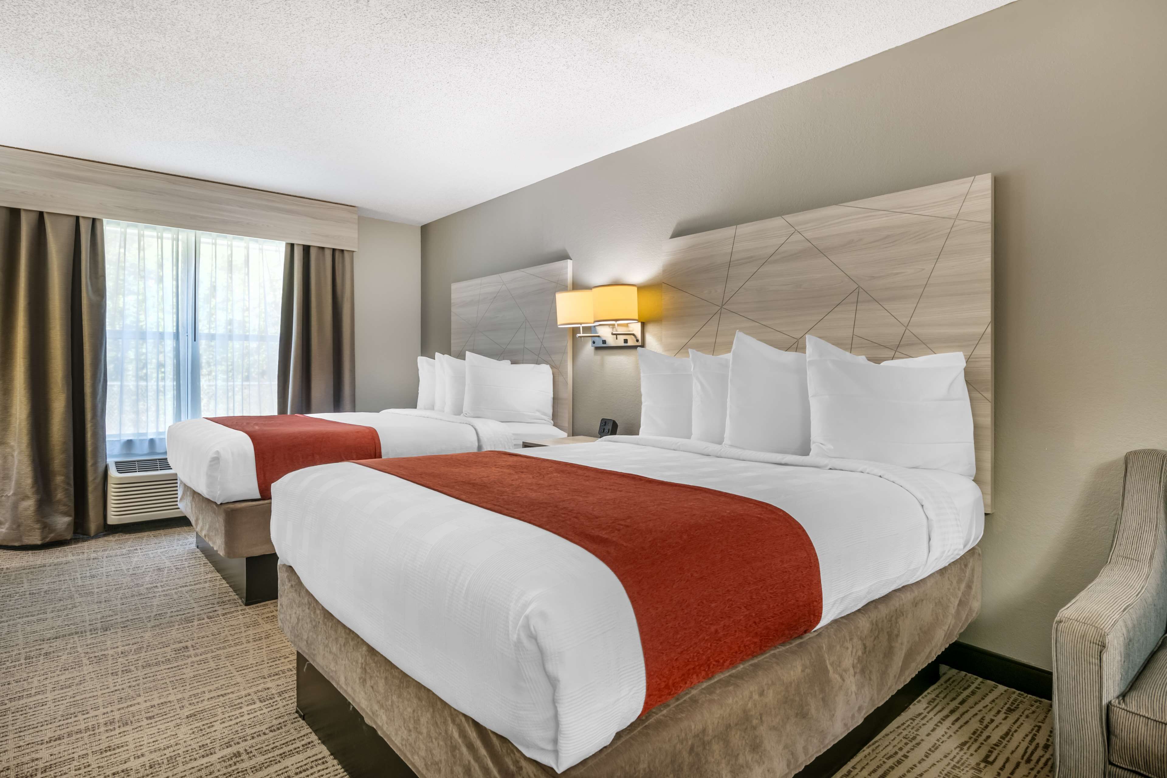 premium bedding, pillow-top beds, desk, laptop workspace