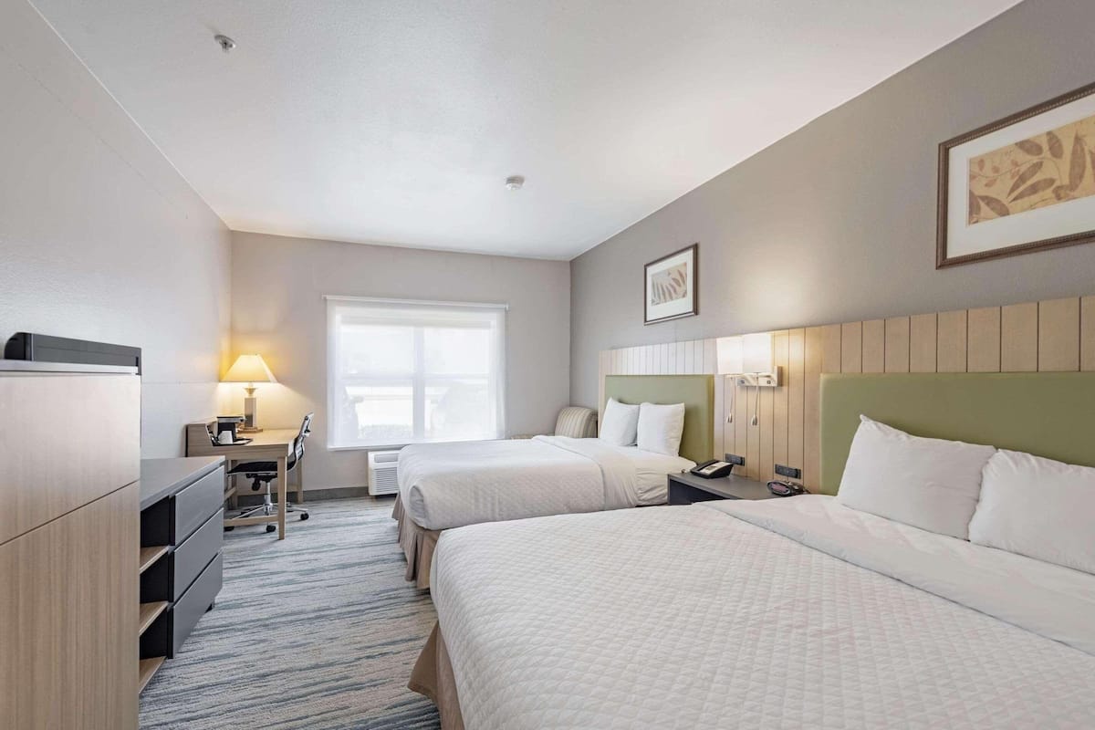 Premium bedding, desk, laptop workspace, iron/ironing board