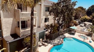 Outdoor pool, open 7:00 AM to 10:00 PM, pool umbrellas, sun loungers