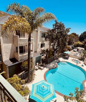 Outdoor pool, pool umbrellas, sun loungers