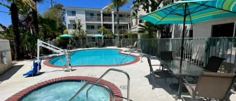 Outdoor pool, open 7:00 AM to 10:00 PM, pool umbrellas, sun loungers