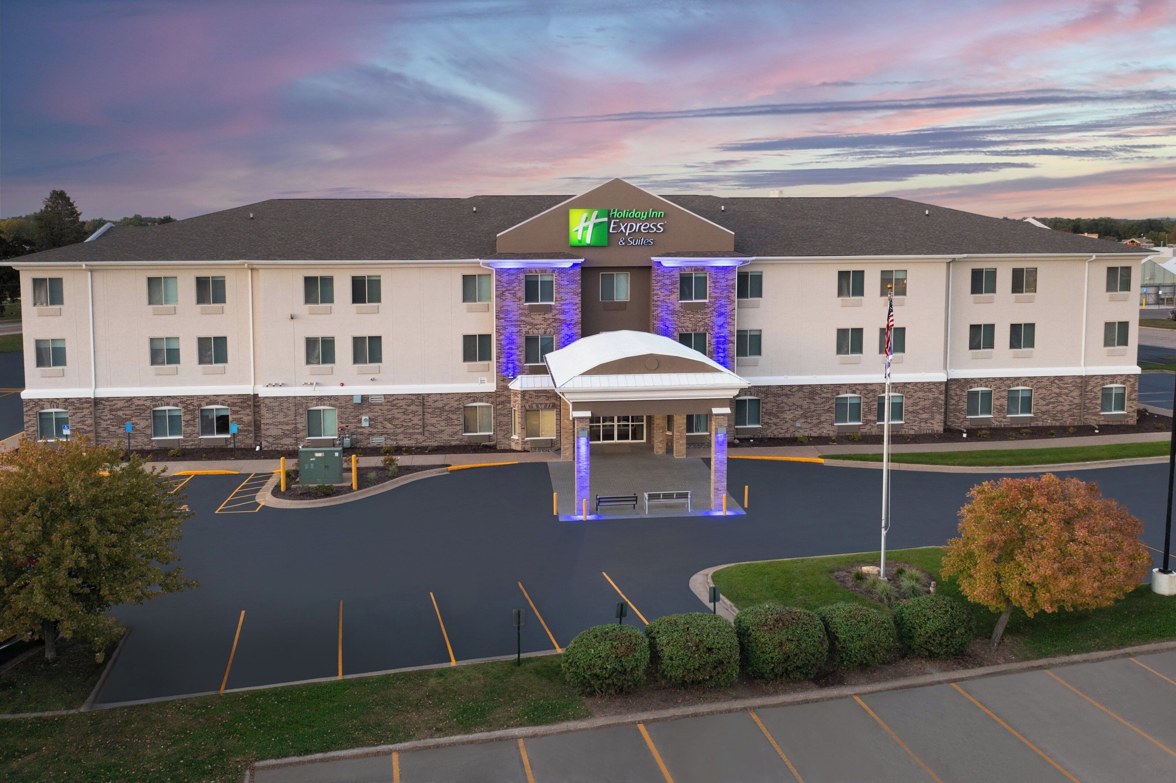 A Holiday Inn Express hotel with a covered entrance, parking lot, and landscaping.