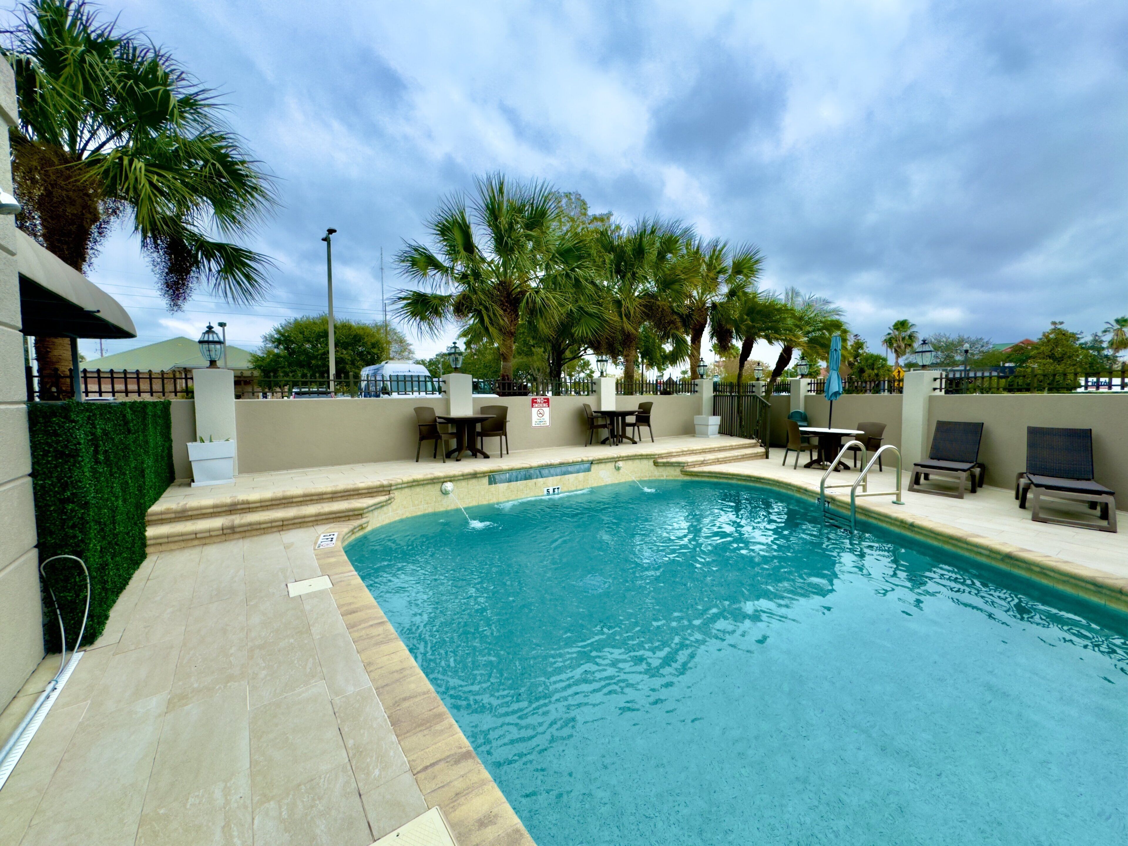 outdoor pool, pool umbrellas, pool loungers