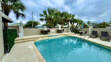 Outdoor pool, pool umbrellas, sun loungers