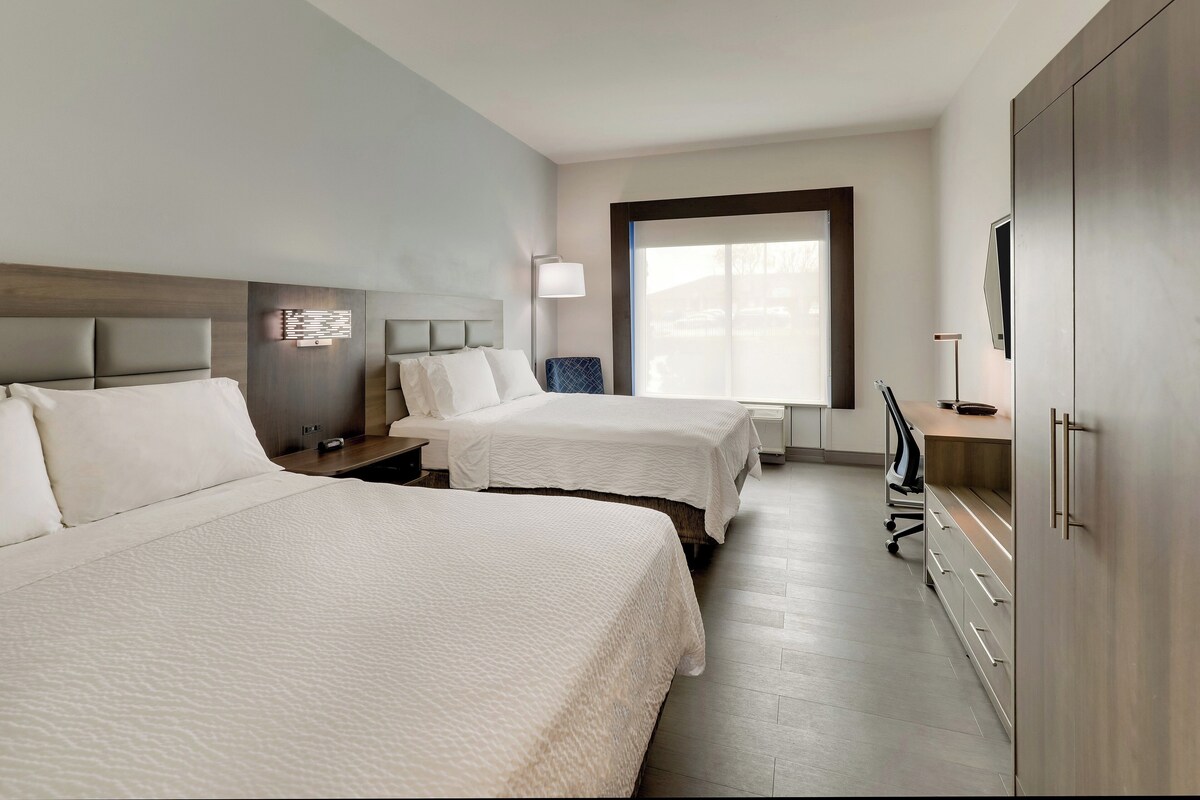 Premium bedding, desk, laptop workspace, blackout curtains