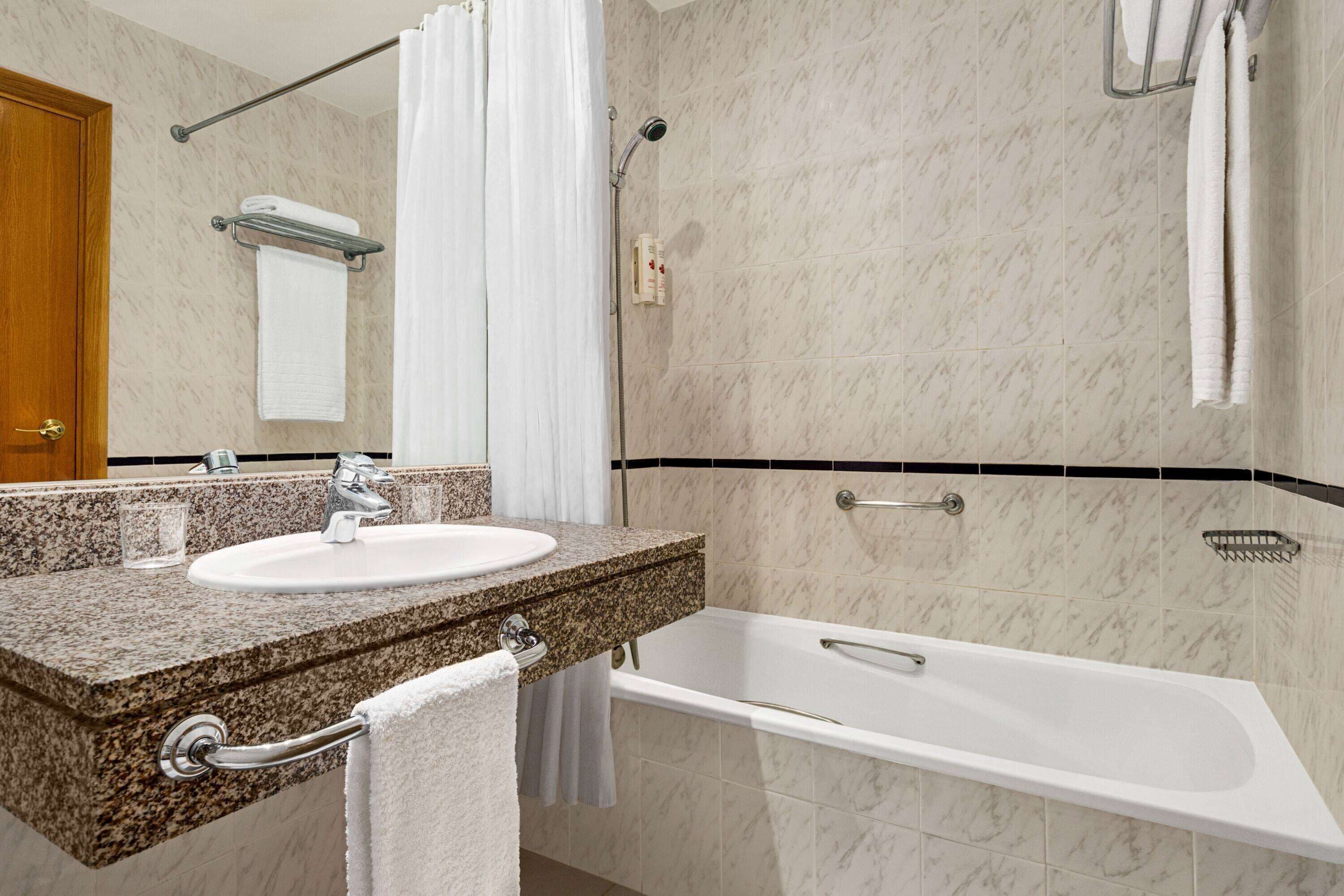 deep-soaking bathtub, free toiletries, hair dryer, towels