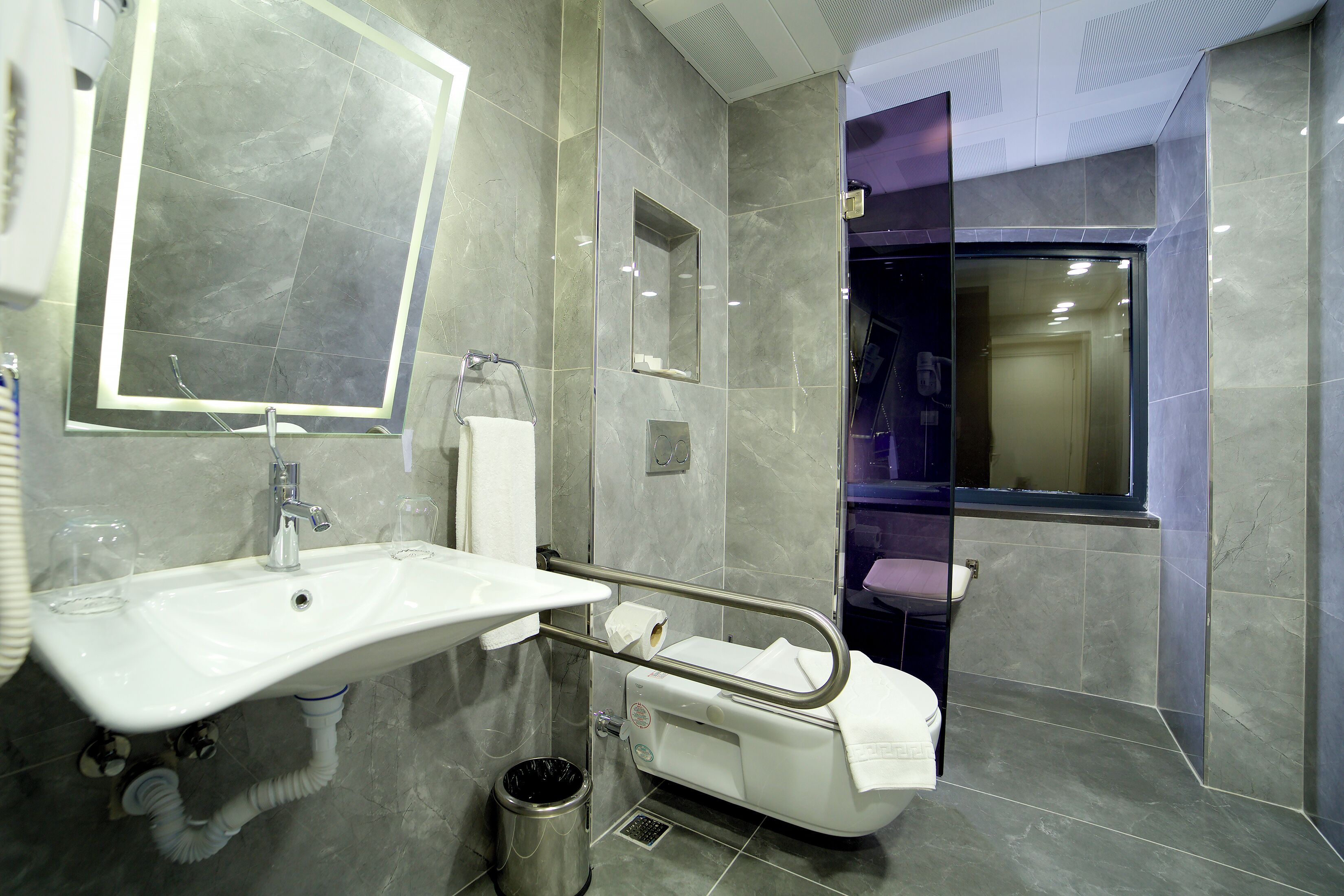 queen room with queen beds accessible room | bathroom | shower, hair dryer, slippers, towels