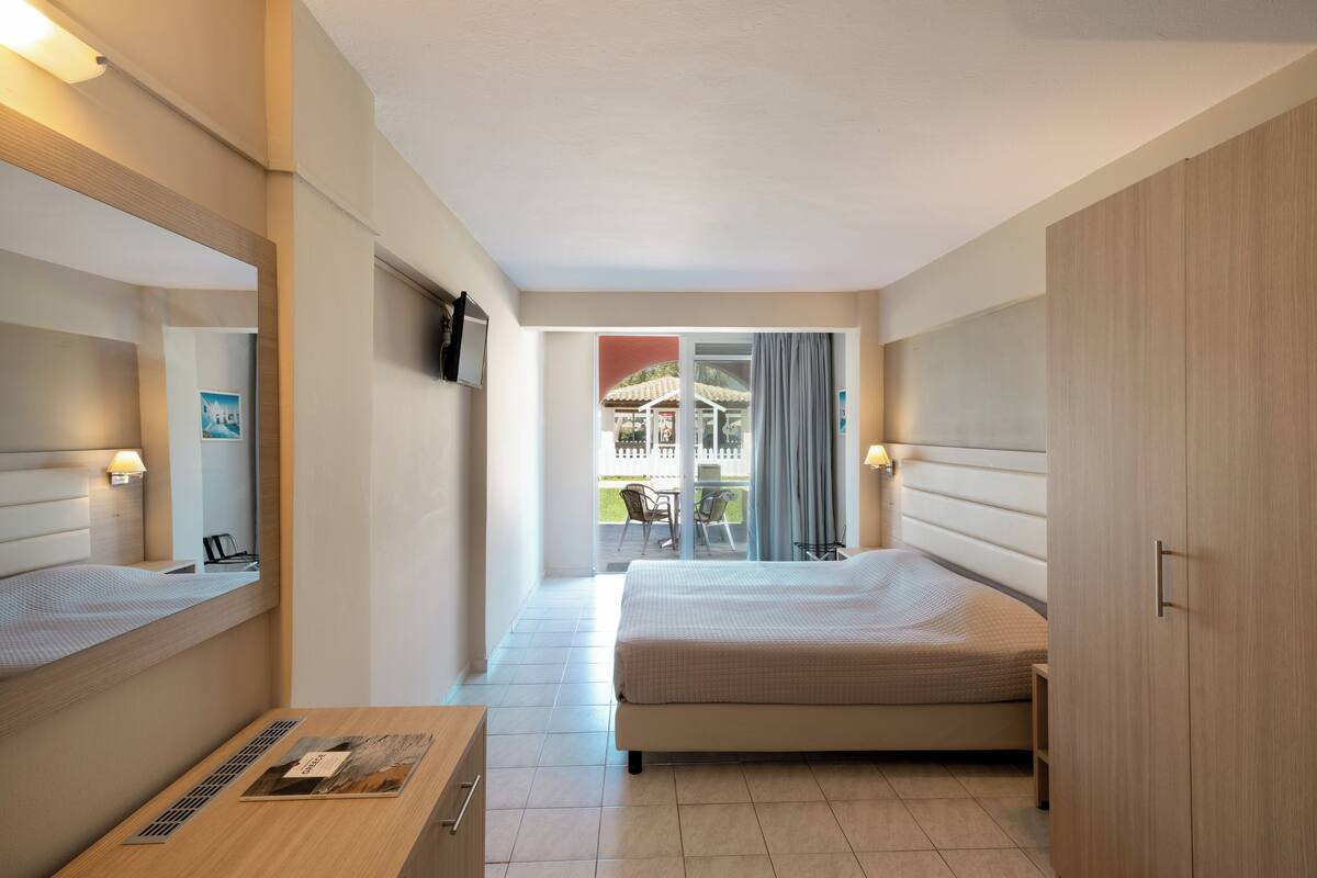 Quadruple Room, Garden View | WiFi (free), bed sheets
