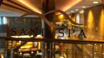 A glass facade with the text "SAND SPA" prominently displayed.