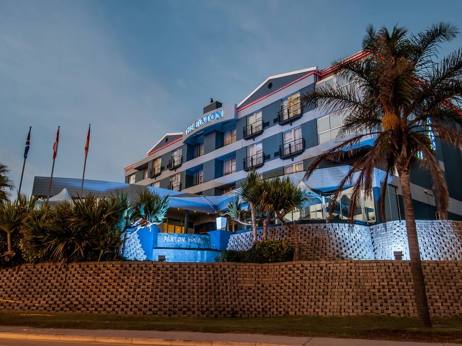 A multi-story hotel with a prominent sign reading "The Buxton."