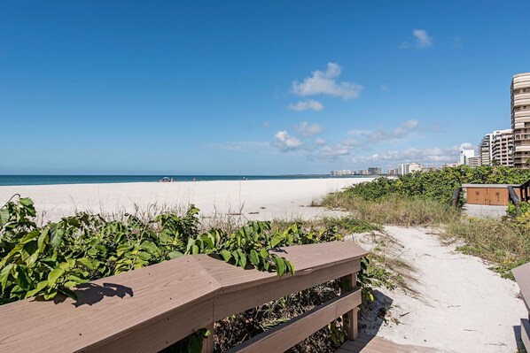 Beach nearby, white sand, beach towels