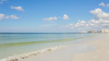 Beach nearby, white sand, beach towels