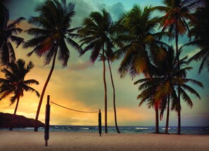 On the beach, sun loungers, beach towels