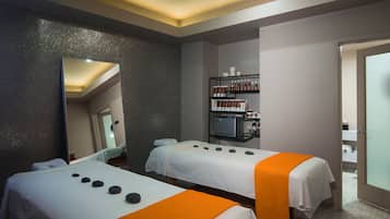 Relax in a serene spa room with two treatment beds and a spacious shelf for your essentials.
