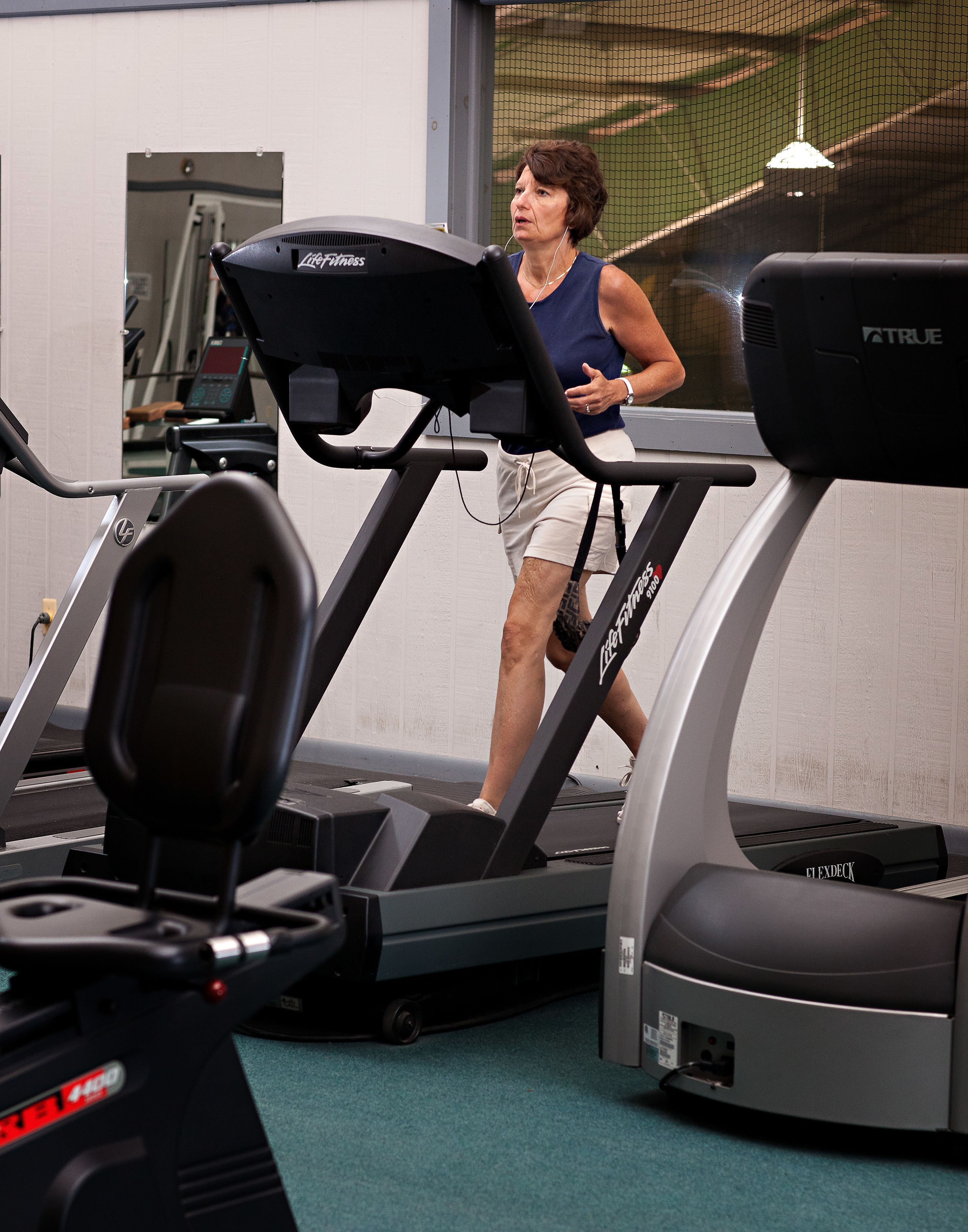 A gym with treadmills and exercise equipment.