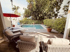 Outdoor pool, open 8:00 AM to 8:00 PM, pool umbrellas, pool loungers