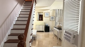 Conch Cottage | Living area | 45-inch Smart TV with digital channels, Hulu, streaming services - The Independent Inn - Formerly Heron House Court  (Key West)