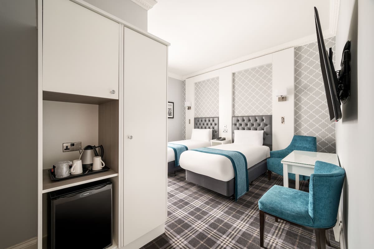 carlton classic twin room (separate building) | desk, laptop workspace, iron/ironing board, free wifi