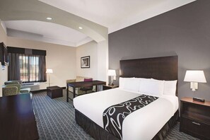 Premium bedding, desk, laptop workspace, blackout curtains