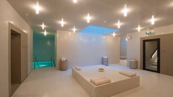 Relax in a serene spa room with a large hot tub and tranquil ambiance.