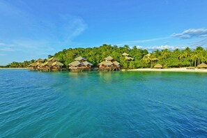 On the beach, white sand, free beach cabanas, sun loungers