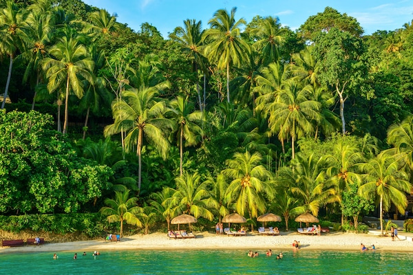 On the beach, white sand, free beach cabanas, sun loungers