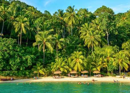 On the beach, white sand, free beach cabanas, sun loungers