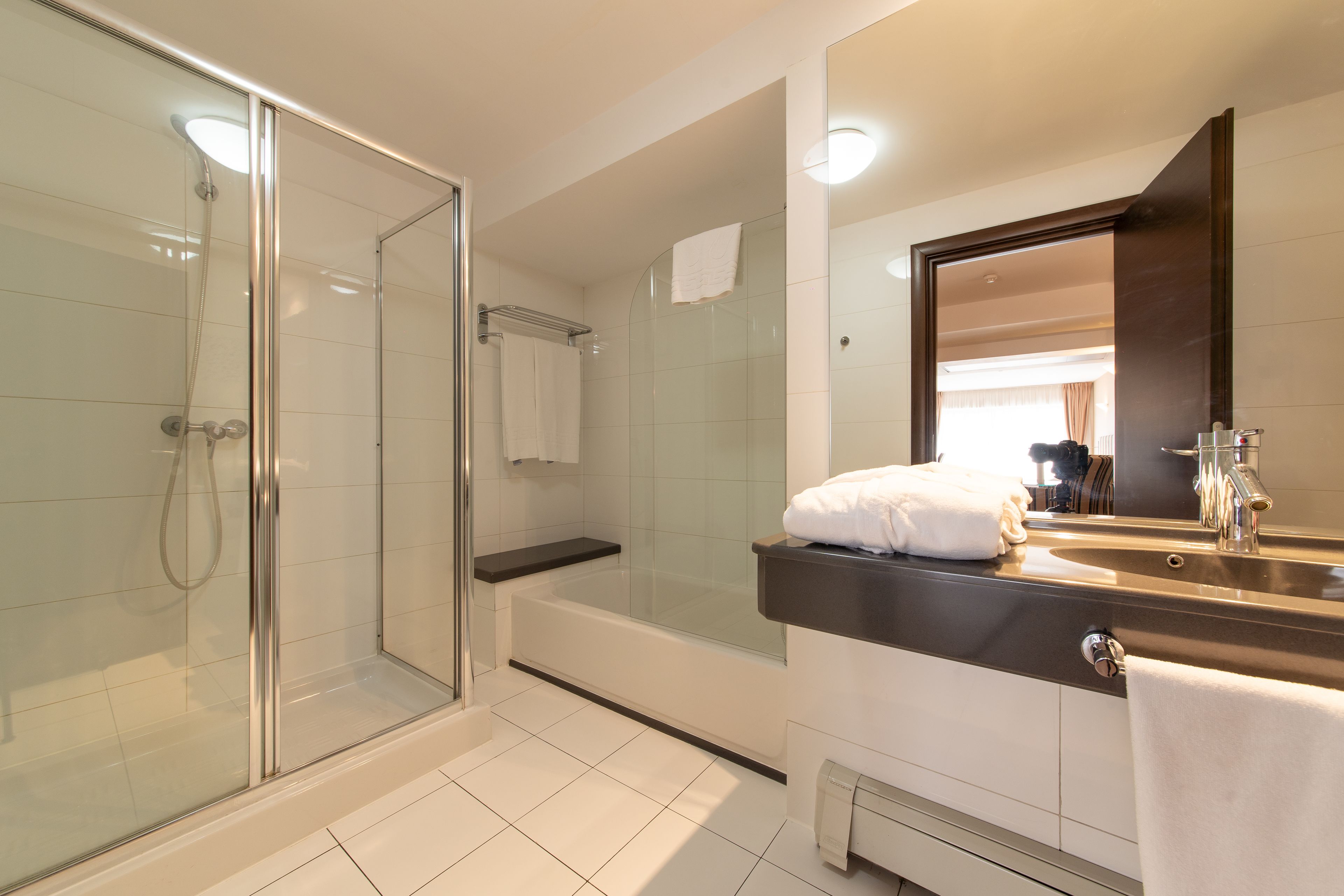 junior suite | bathroom | combined shower/bathtub, hair dryer, bathrobes, slippers