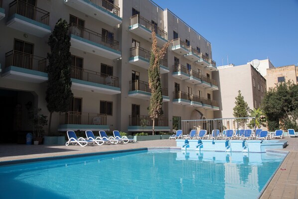 Outdoor pool, pool umbrellas, pool loungers