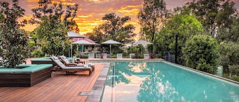 2 outdoor pools, pool umbrellas, pool loungers