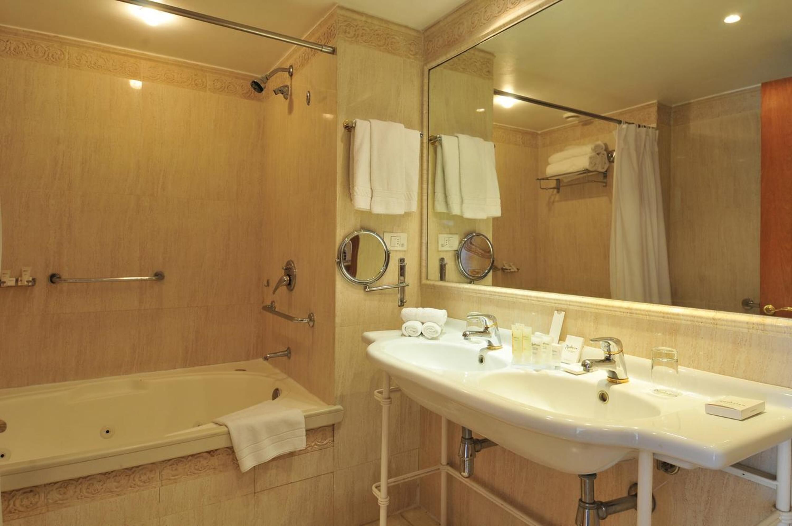 suite, 1 king bed, non smoking, jetted tub | bathroom | separate bathtub and shower, free toiletries, hair dryer, towels
