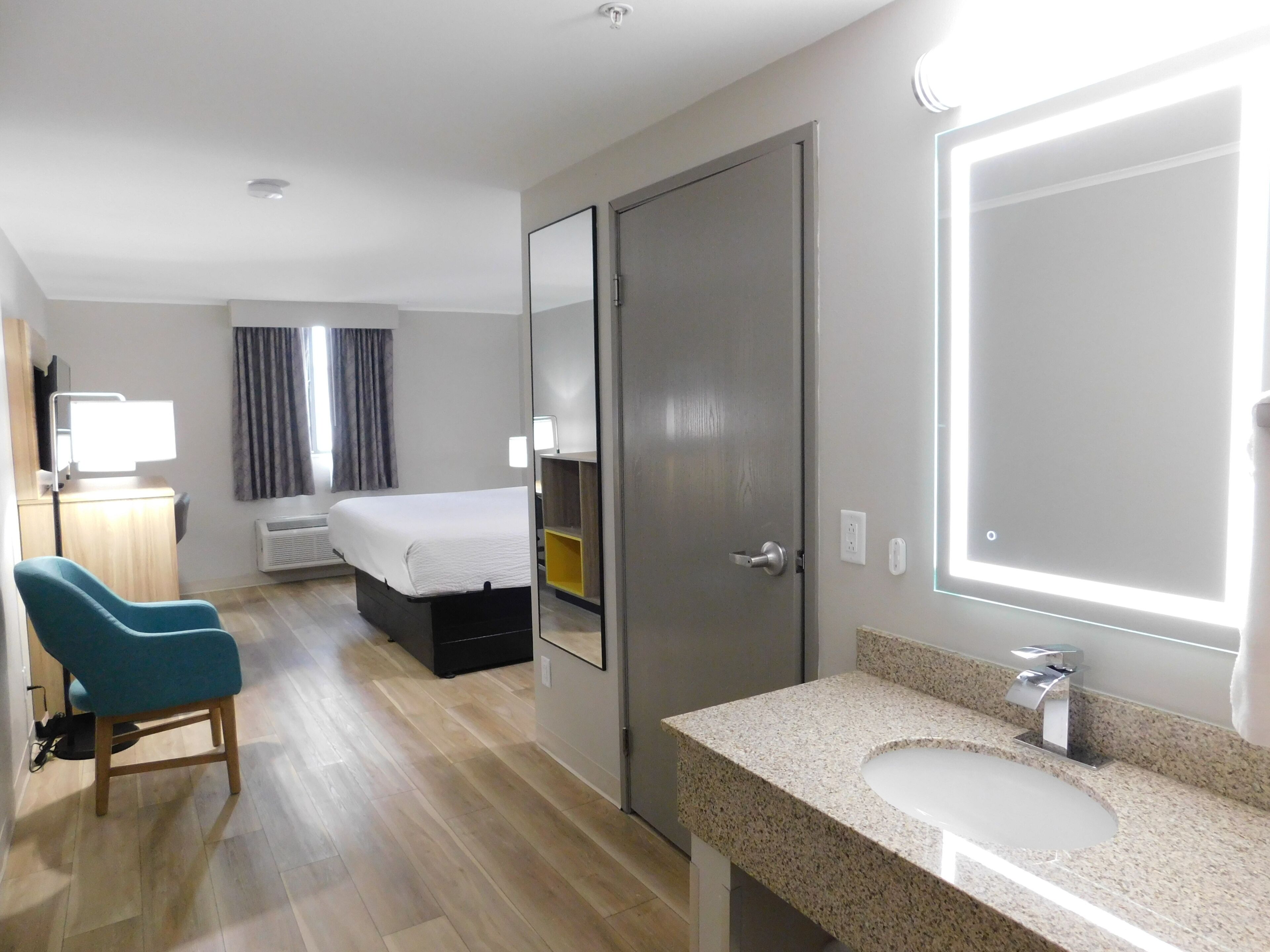 Suite, 1 Bedroom, Non Smoking (1 King Bed and 1 Queen Bed) | In-room safe, desk, blackout drapes, iron/ironing board