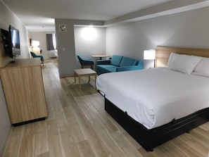 Suite, 1 Bedroom, Non Smoking (1 King Bed and 1 Queen Bed) | Living area | TV - Days Inn by Wyndham Effingham (Effingham)